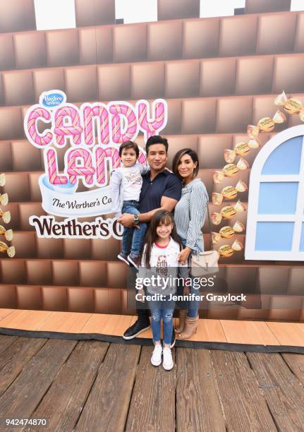 Mario Lopez with his wife, Courtney, and children, Gia and Dominic, celebrated National Caramel Day with Werthers Original at Santa Monica Pier on...