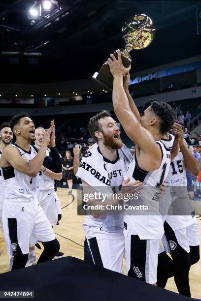 Nick Johnson of the Austin Spurs holding the Western Conference Champion trophy celebrates with his teammates after defeating the South Bay Lakers...