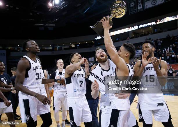 Nick Johnson of the Austin Spurs holding the Western Conference Champion trophy celebrates with his teammates after defeating the South Bay Lakers...