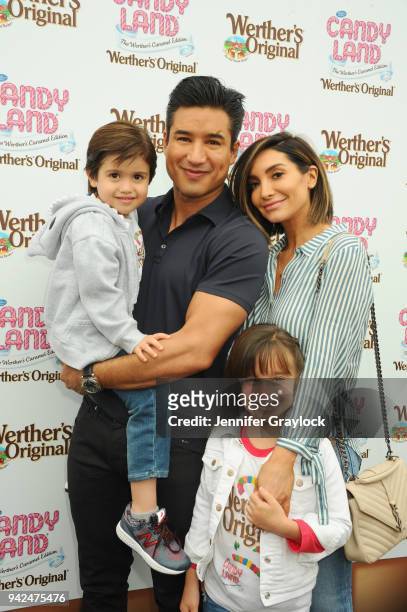 Mario Lopez with his wife, Courtney, and children, Gia and Dominic, celebrated National Caramel Day with Werthers Original at Santa Monica Pier on...
