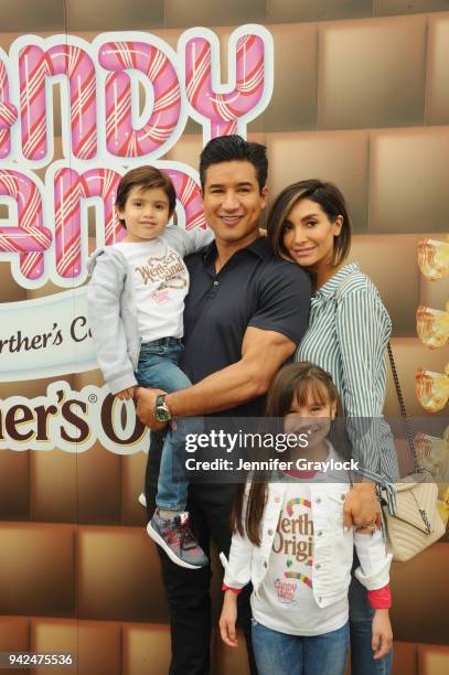 Mario Lopez with his wife, Courtney, and children, Gia and Dominic, celebrated National Caramel Day with Werthers Original at Santa Monica Pier on...