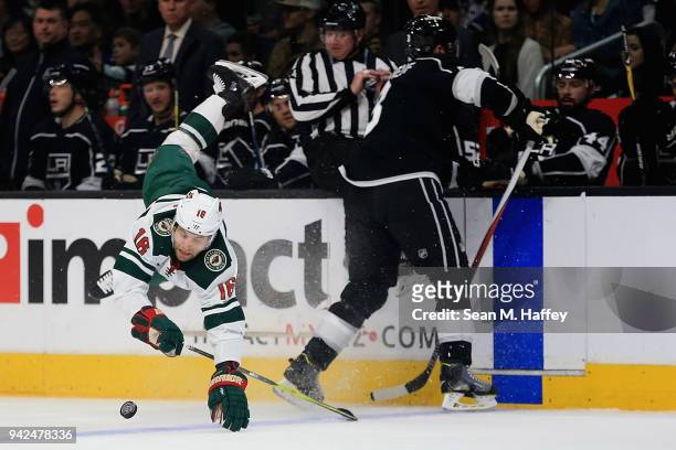 Jason Zucker of the Minnesota Wild is upended by Dion Phaneuf of the Los Angeles Kings during the first period at Staples Center on April 5, 2018 in...