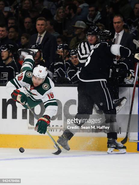 Jason Zucker of the Minnesota Wild is upended by Dion Phaneuf of the Los Angeles Kings during the first period at Staples Center on April 5, 2018 in...