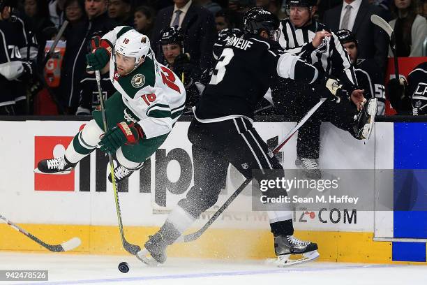 Jason Zucker of the Minnesota Wild is upended by Dion Phaneuf of the Los Angeles Kings during the first period at Staples Center on April 5, 2018 in...