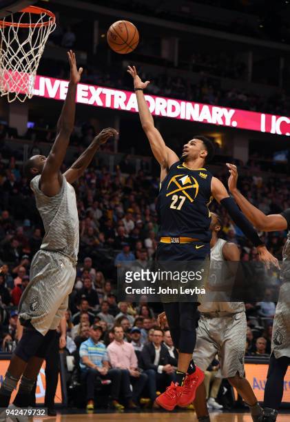 Denver Nuggets guard Jamal Murray goes up for an easy basket against Minnesota Timberwolves center Gorgui Dieng during the first quarter on April 5,...