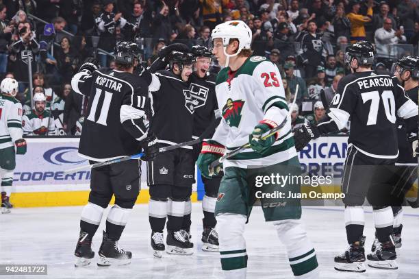 Anze Kopitar, Dustin Brown, Christian Folin, and Tanner Pearson of the Los Angeles Kings celebrate after scoring a goal against the Minnesota Wild at...