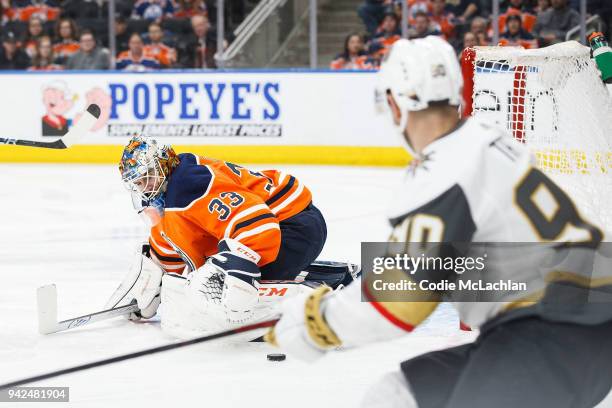 Goaltender Cam Talbot of the Edmonton Oilers makes a save against Tomas Tatar of the Vegas Golden Knights at Rogers Place on April 5, 2018 in...