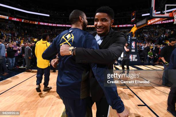 Gary Harris of the Denver Nuggets hugs Devin Harris of the Denver Nuggets after the game against the Minnesota Timberwolves on April 5, 2018 at the...