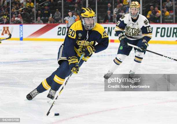 Michigan Wolverines forward Cooper Marody looks to shoot during a Frozen Four Semifinal between the University of Michigan and Notre Dame on April 5,...