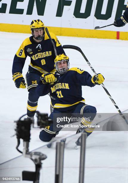 Michigan Wolverines forward Michael Pastujov celebrates his 3rd period goal during a Frozen Four Semifinal between the University of Michigan and...