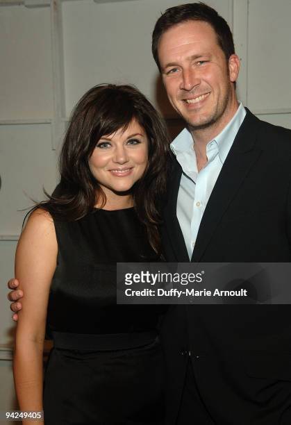 Actress Tiffani Thiessen and Brady Smith attend Thuy Spring 2010 during Mercedes-Benz Fashion Week at Bryant Park on September 13, 2009 in New York...