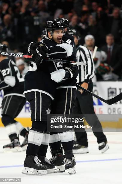 Dustin Brown is congratulated b Drew Doughty of the Los Angeles Kings after scoring the winning goal in overtime, his fourth of the game against the...