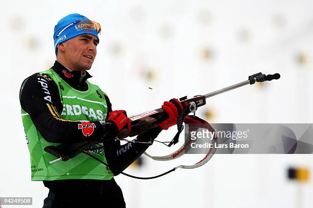 Michael Greis of Germany prepares to shoot at the shooting stand during a training session prior to the IBU Biathlon World Cup on December 10, 2009...