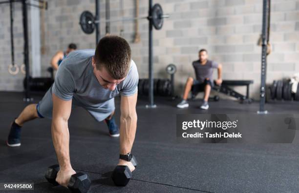 man at the gym - group of people flexing biceps stock pictures, royalty-free photos & images