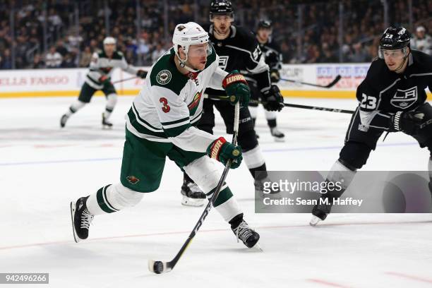 Charlie Coyle of the Minnesota Wild shoots the puck as Dustin Brown of the Los Angeles Kings defends during the third period of a game at Staples...