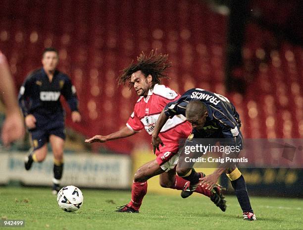 Christian Karembeu of Middlesbrough tussles with Damien Francis of Wimbledon during the Worthington Cup 3rd round match played at Selhurst Park, in...