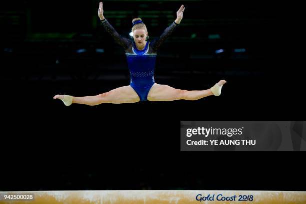 Cara Kennedy of Scotland competes on the balance beam during the women's team final and individual qualification in the artistic gymnastics event...