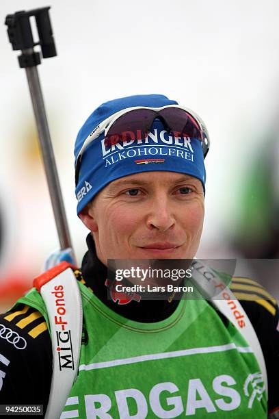 Andreas Birnbacher of Germany smiles at the shooting stand during a training session prior to the IBU Biathlon World Cup on December 10, 2009 in...