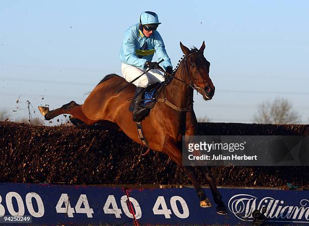 Paul Moloney and Deep Purple clear the last fence before landing The totesport.com Peterborough Steeple Chase Race run at Huntingdon Racecourse on...
