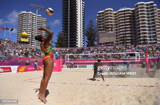 Renisha Stafford of Grenada serves as she and Thornia Williams of Grenada play against Scotland's Melissa Coutts and Lynne Beattie in their...