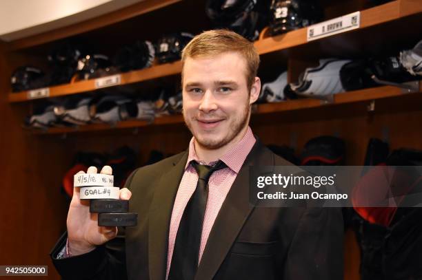 Dustin Brown of the Los Angeles Kings poses for a photo after scoring four goals in an overtime win against the Minnesota Wild at STAPLES Center on...