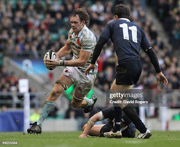 William Jones of Cambridge is tackled by Tim Catling during the Nomura Varsity match between Oxford University and Cambridge University at Twickenham...