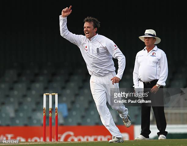 Graeme Swann of England celebrates taking the wicket of David Wiese to take him to five wickets during day two of the two day warm up match between...