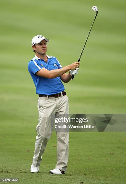 Richard Sterne of South Africa eyes up his approach shot into the 14th green during the first round of the Alfred Dunhill Championship at Leopard...