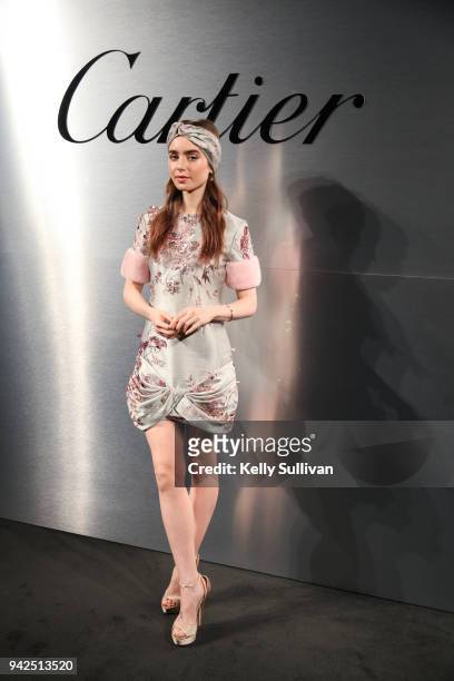 Actress Lily Collins arrives on the red carpet for the Santos de Cartier Watch Launch at Pier 48 on April 5, 2018 in San Francisco, California.