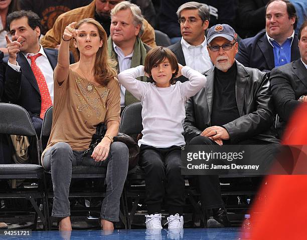 Celine Dion, Rene Charles Angelil and Rene Angelil attend the Portland Trailblazers Vs. New York Knicks game at Madison Square Garden on December 7,...