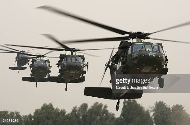 Blackhawk helicopter carrying U.S. Secretary of Defense Robert Gates arrives in the Green Zone December 10, 2009 in Baghdad, Iraq. Secretary Gates...
