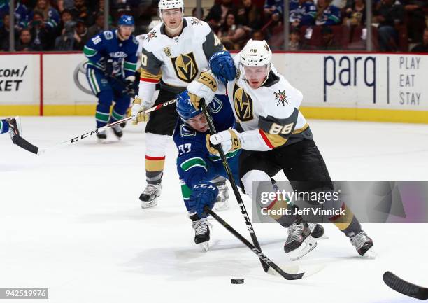 April 3: Nikolay Goldobin of the Vancouver Canucks checks Nate Schmidt of the Vegas Golden Knights during their NHL game at Rogers Arena April 3,...