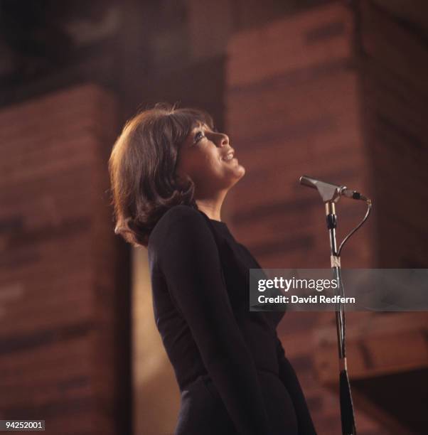 French singer and actress Juliette Greco performs on a television show in London circa 1965.