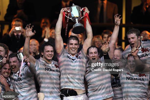 Dan Vickerman, the Cambridge captain, raises the trophy after their victory in the Nomura Varsity match between Oxford University and Cambridge...