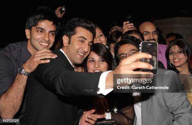 Actor Ranbir Kapoor takes pictures with fans as he attends the "Rocket Singh - Salesman of the Year" premiere during day two of the 6th Annual Dubai...