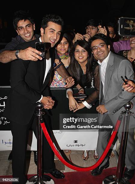 Actor Ranbir Kapoor takes pictures with fans as he attends the "Rocket Singh - Salesman of the Year" premiere during day two of the 6th Annual Dubai...