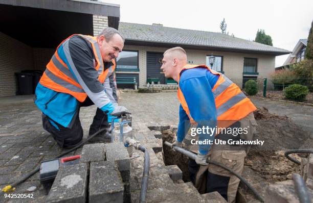 March 14: Deutsche Glasfaser is laying fiber optic cables in rural areas in a FTTH process on March 14, 2018 in BRAMSCHE, GERMANY.