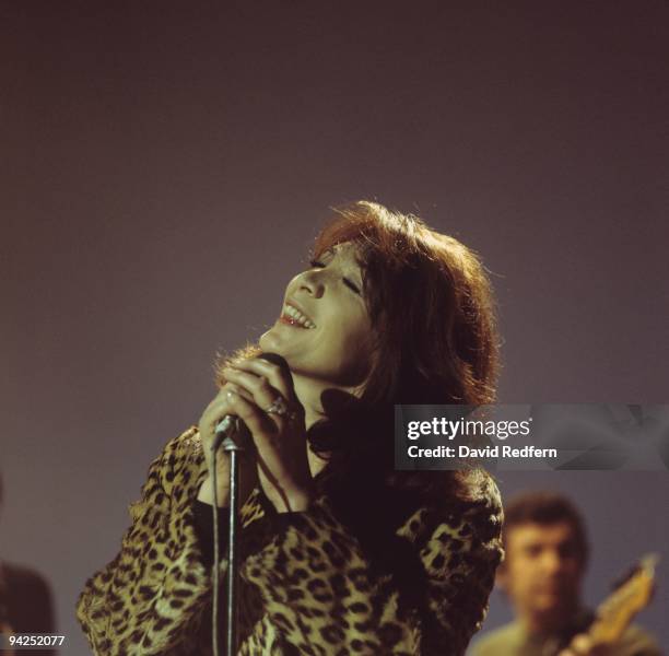 French singer and actress Juliette Greco, wearing a leopard print coat, performs on a television show circa 1973.