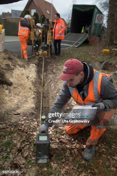 March 14: Deutsche Glasfaser is laying fiber optic cables in rural areas in a FTTH process on March 14, 2018 in BRAMSCHE, GERMANY.