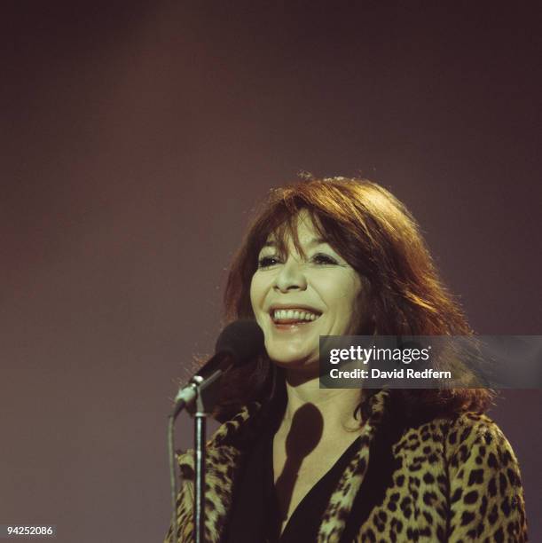 French singer and actress Juliette Greco, wearing a leopard print coat, performs on a television show circa 1973.