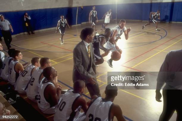 High School Basketball: View of playground legend and Dwight HS coach Pee Wee Kirkland watching Vedad Ozmanovic from sidelines during game vs Our...