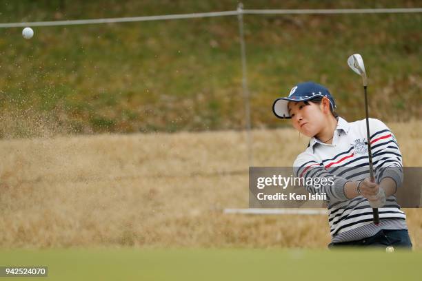 Yumi Kudo of Japan plays a shot from a bunker on the 1st hole during the final round of the Hanasaka Ladies Yanmar Golf Tournament at Biwako Country...