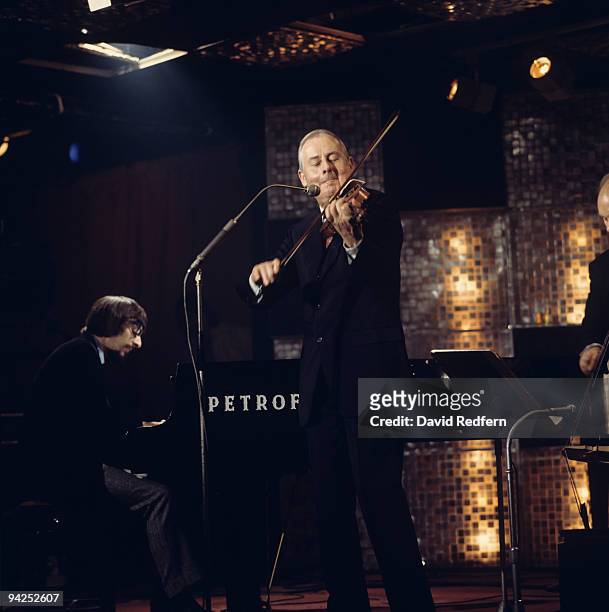 French jazz violinist Stephane Grappelli performs on stage at Ronnie Scott's in London, England circa 1970.