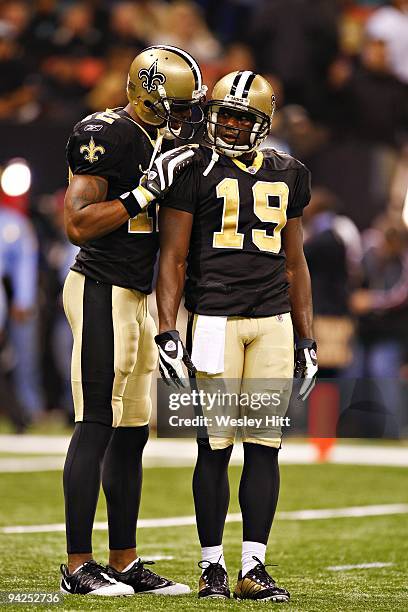 Wide receivers Marques Colston and Devery Henderson of the New Orleans Saints talk during a game against the New England Patriots at the Louisiana...