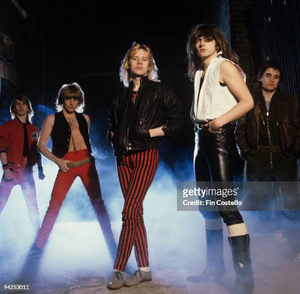 Posed group portrait of Girl. Left to right are Simon Laffy, Phil Collen, Gerry Laffy, Philip Lewis and Pete Barnacle in 1982.