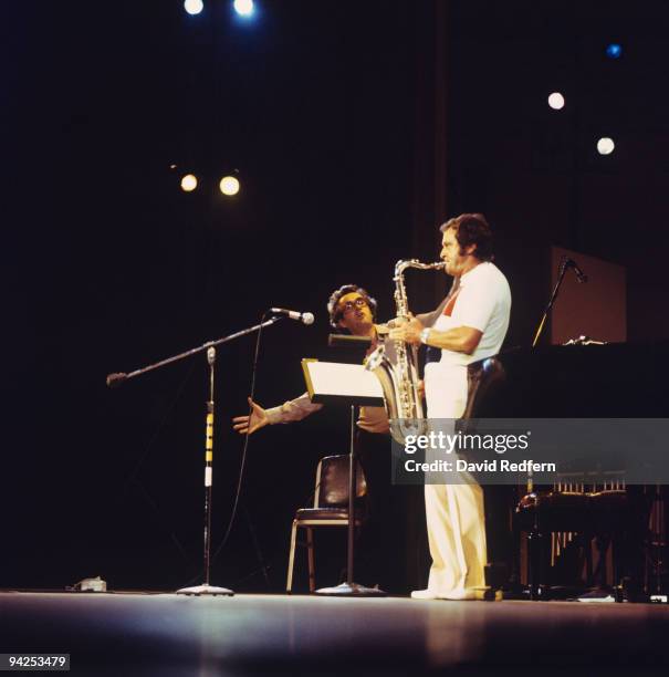 American jazz saxophonist Stan Getz performs live on stage with French pianist Michel Legrand circa 1980.