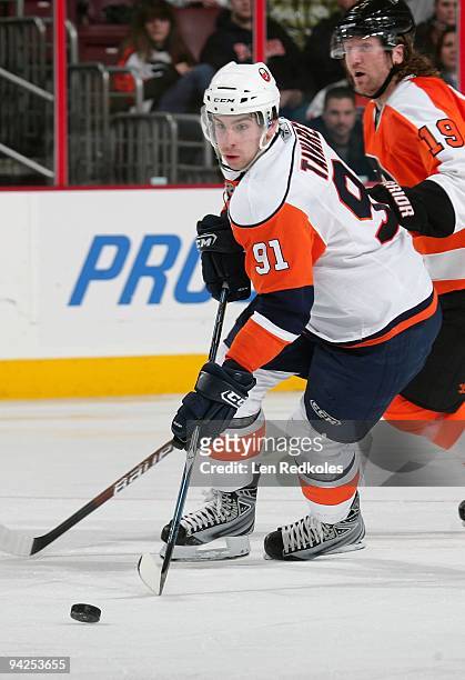 John Tavares of the New York Islanders skates with the puck against Scott Hartnell of the Philadelphia Flyers on December 8, 2009 at the Wachovia...