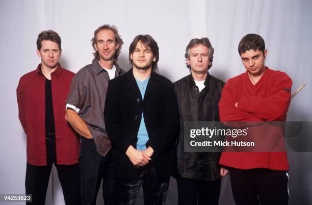 Posed group portrait of Genesis. Left to right are Anto Drennan, Mike Rutherford, Ray Wilson, Tony Banks and Nir Zidkyahu in 1998.