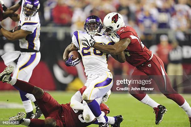 Minnesota Vikings Adrian Peterson in action during tackle by Arizona Cardinals Adian Wilson . Glendale, AZ 12/6/2009 CREDIT: John Biever