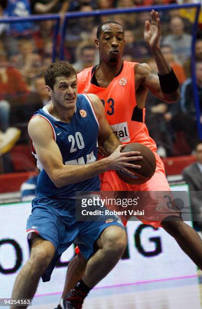 Marin Rozic, #20 of Cibona competes with Terence Morris, #23 of Regal FC Barcelona during the Euroleague Basketball Regular Season 2009-2010 Game Day...